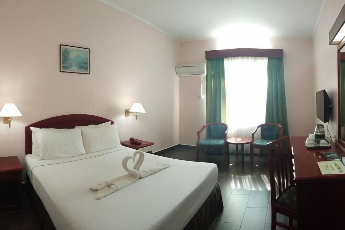 Minibar, desk, bed sheets