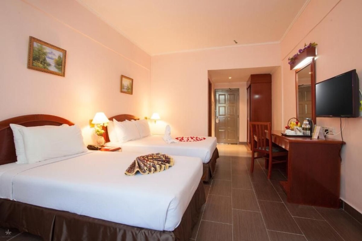 Minibar, desk, bed sheets