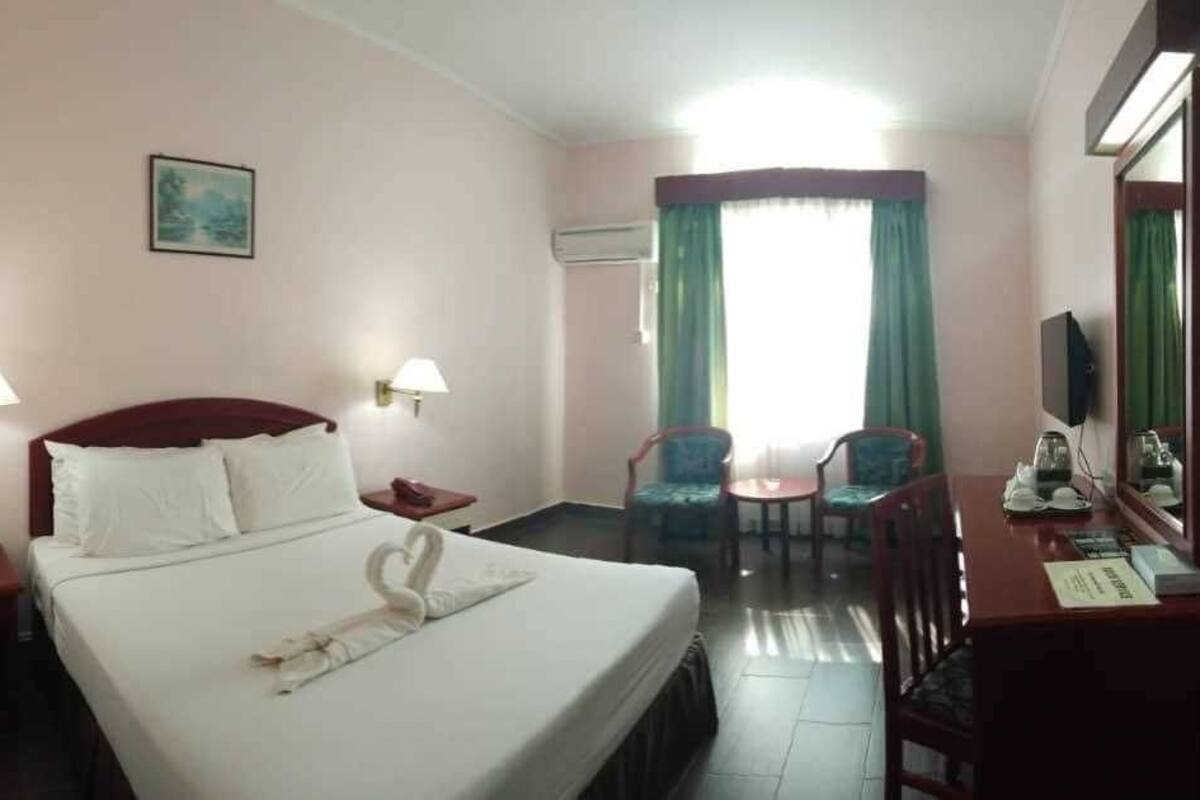Minibar, desk, bed sheets