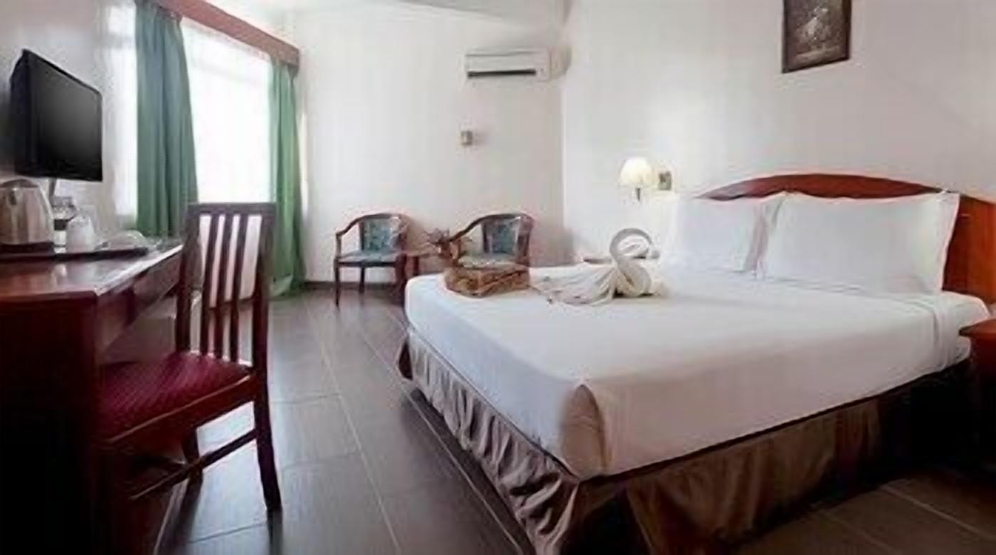 Minibar, desk, bed sheets