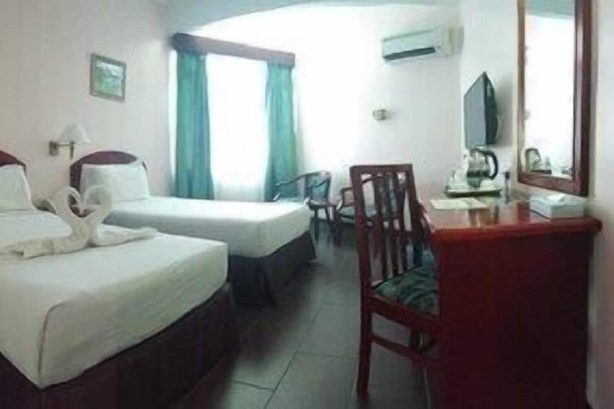 Minibar, desk, bed sheets