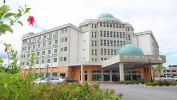 Hotel Seri Malaysia features a striking dome structure and lush surroundings.