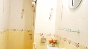 A bathroom with a toilet, bidet, sink, and a mirror. - Donmuang - Impact Condo Service (Pak Kret)