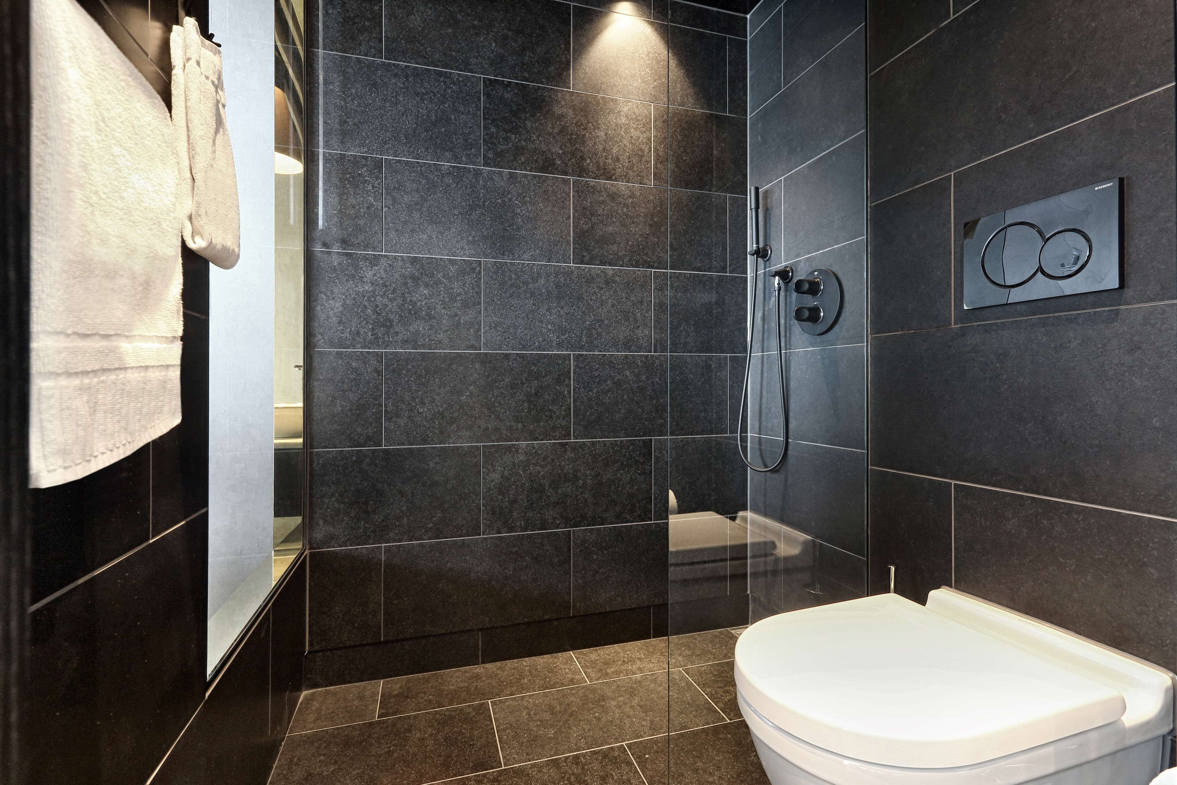 shower, rainfall showerhead, hair dryer, towels