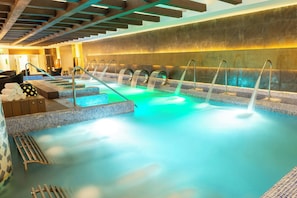 A spa area with multiple hot tubs, a wooden ceiling, and tiled flooring. - Royalton Riviera Cancun, An Autograph Collection All-Inclusive Resort & Casino - Newly Renovated (Puerto Morelos)