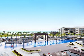 8 outdoor pools, pool umbrellas, pool loungers - Royalton Riviera Cancun, An Autograph Collection All-Inclusive Resort & Casino (Puerto Morelos)