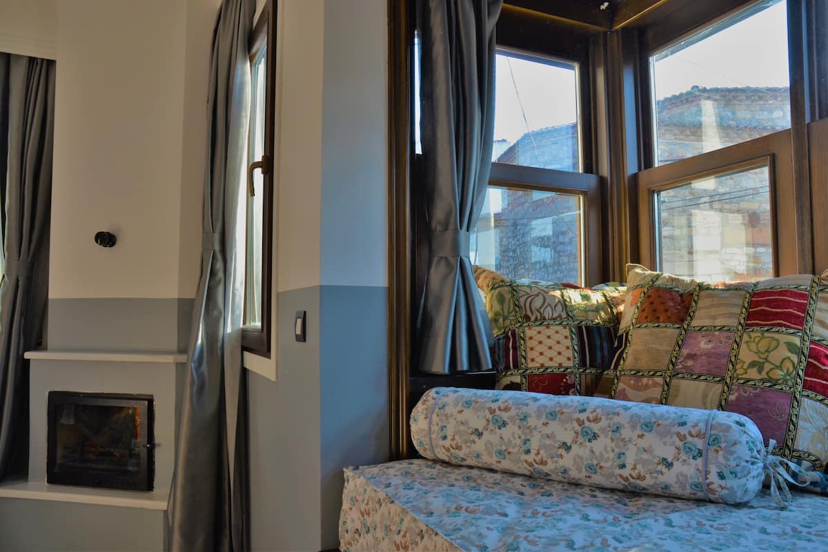 romantic suite, 1 bedroom, partial sea view | living area | 84-inch flat-screen tv with satellite channels, tv