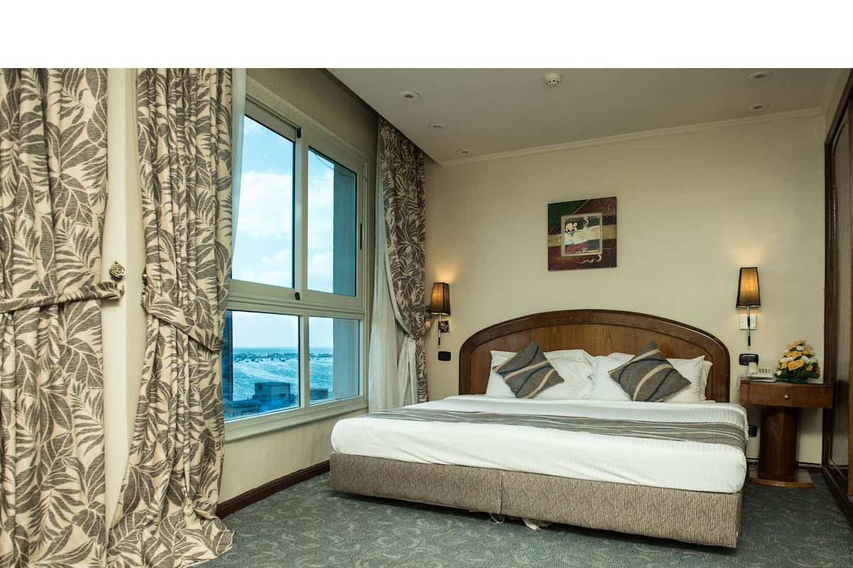 Deluxe Room (with Sea Side View) | In-room safe, desk, blackout curtains, free cots/infant beds