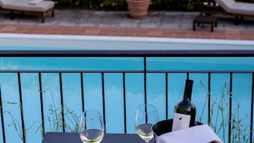 Seasonal outdoor pool, open 9:30 AM to 7:00 PM, pool umbrellas