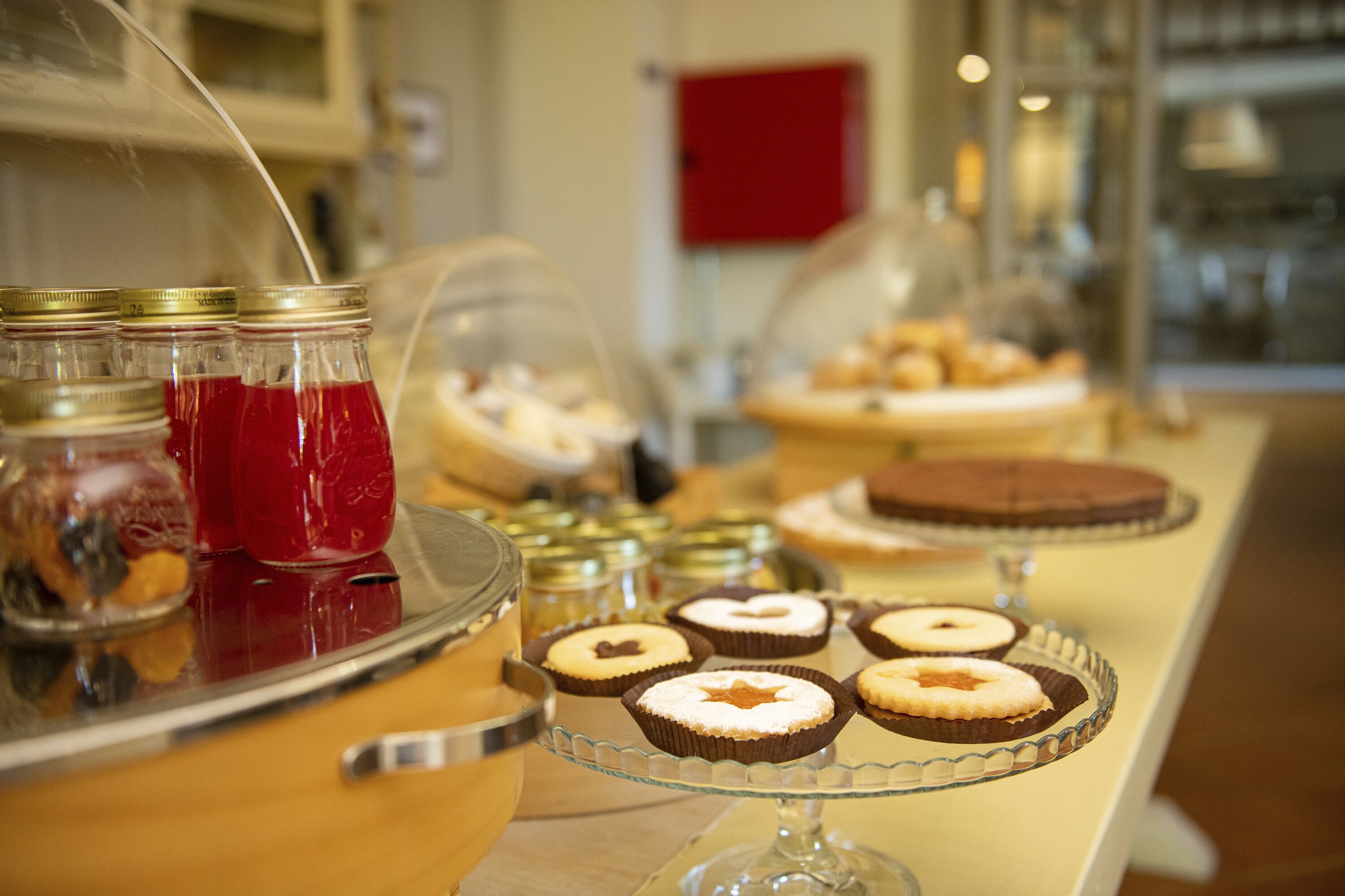 A buffet with various desserts and beverages.