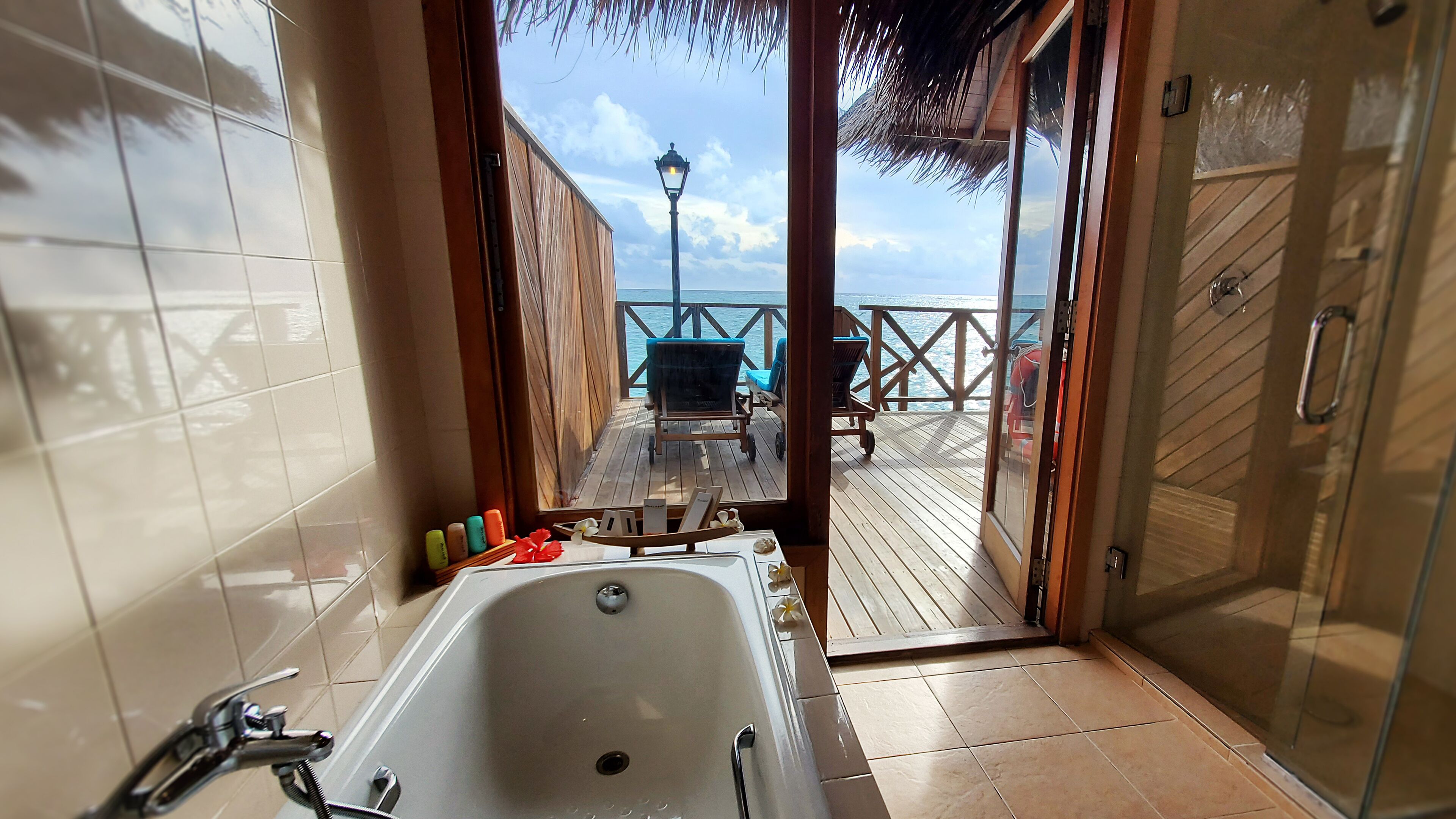 water villa | bathroom | eco-friendly toiletries, hair dryer, bathrobes, towels