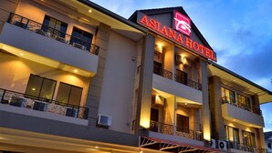 A multi-story hotel with balconies and a prominent sign reading "ASIAN HOTEL". - Asiana Hotel (Kota Kinabalu)