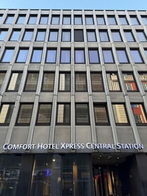 A modern building with a grid of windows and a sign reading "Comfort Hotel Xpress Central Station". - Comfort Hotel Xpress Central Station (Oslo)