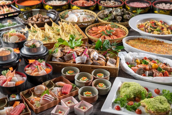 A variety of seafood dishes and appetizers arranged on a table. - Shirahama Ocean Resort (Minamiboso)