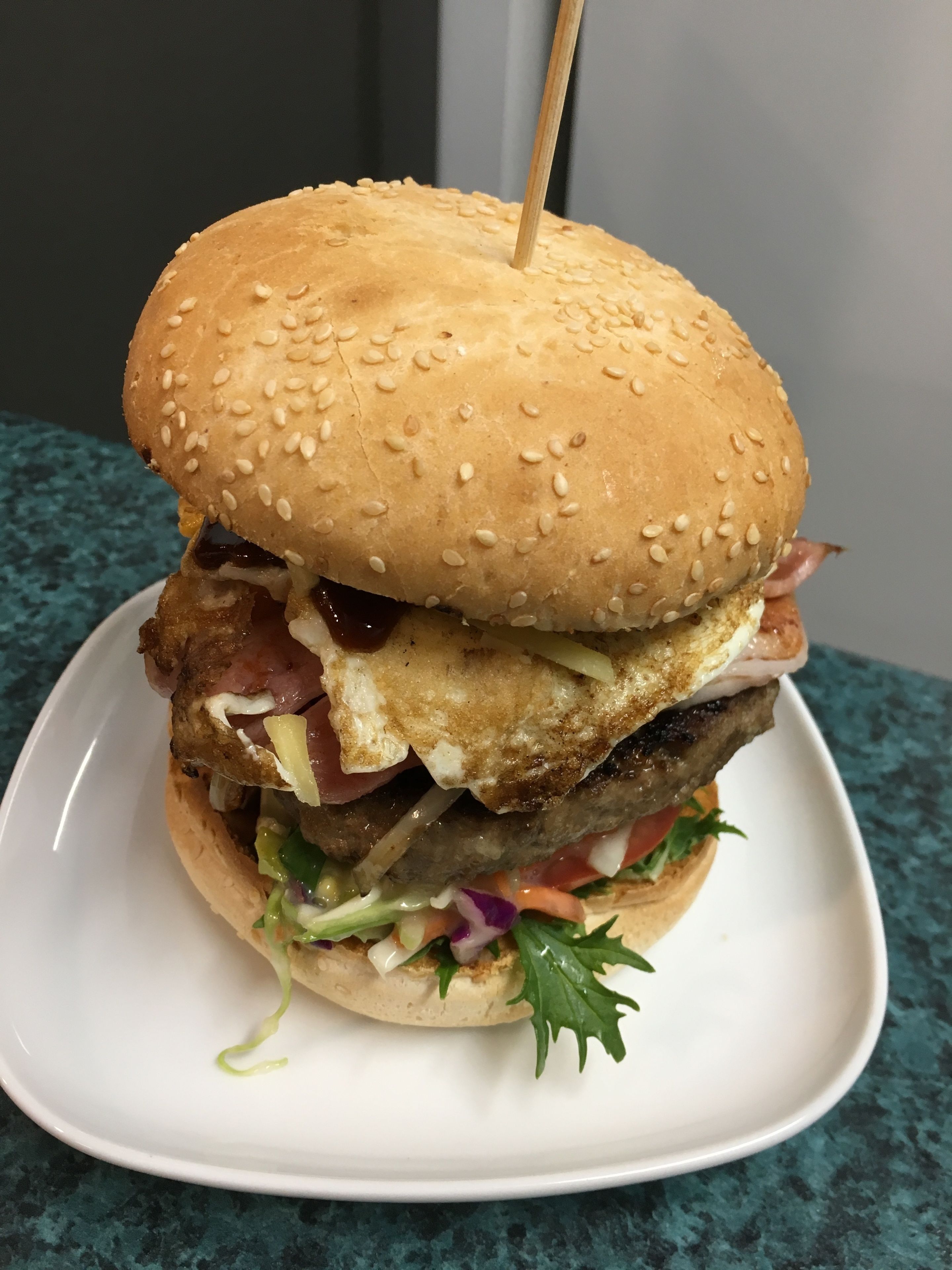 A sandwich on a white plate.