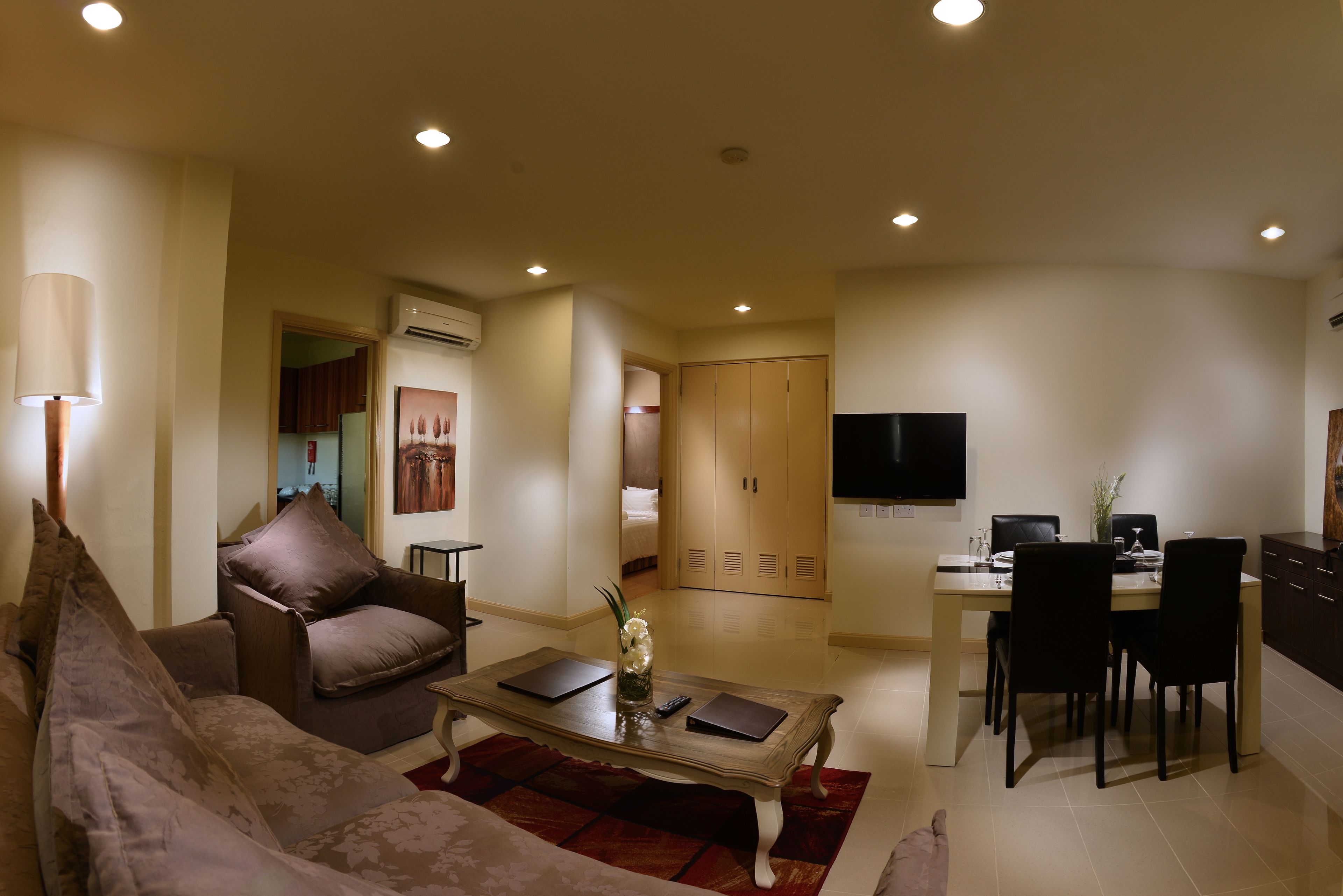 Family Suite, 2 Bedrooms | Living area | 32-inch LCD TV with cable channels, TV