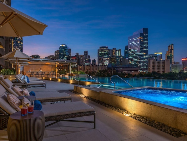 Outdoor pool, open 8:00 AM to 8:00 PM, pool umbrellas, pool loungers