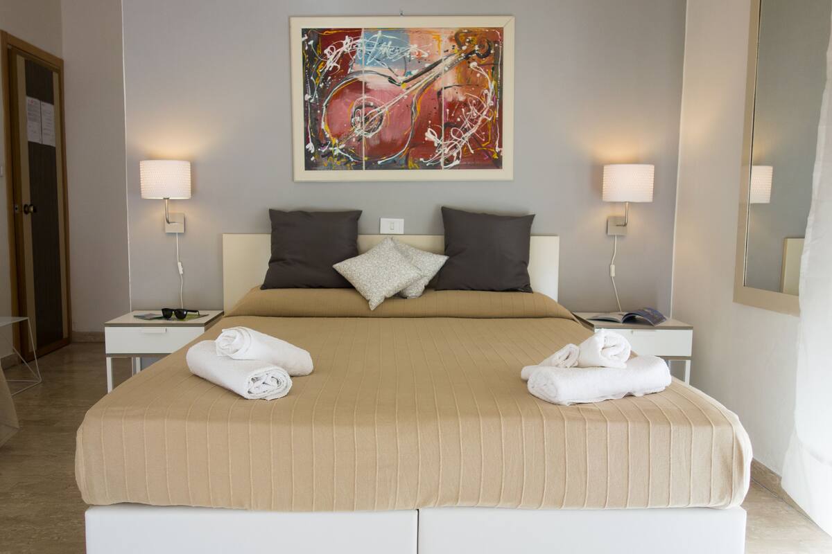 Family Room, Balcony, Mountain View | Minibar, individually furnished, desk, laptop workspace