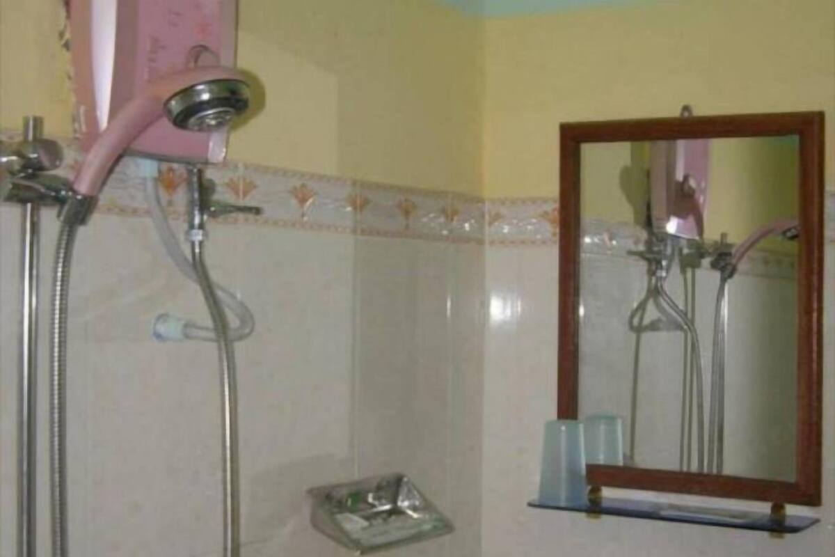 Bathroom | Shower, hair dryer, slippers, towels