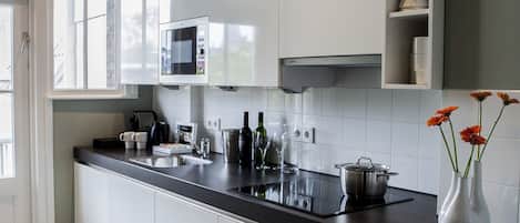Deluxe Apartment, 2 Bedrooms | Private kitchen | Fridge, microwave, oven, stovetop