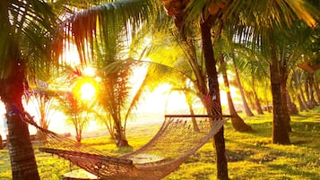 On the beach, sun-loungers, beach umbrellas, beach towels
