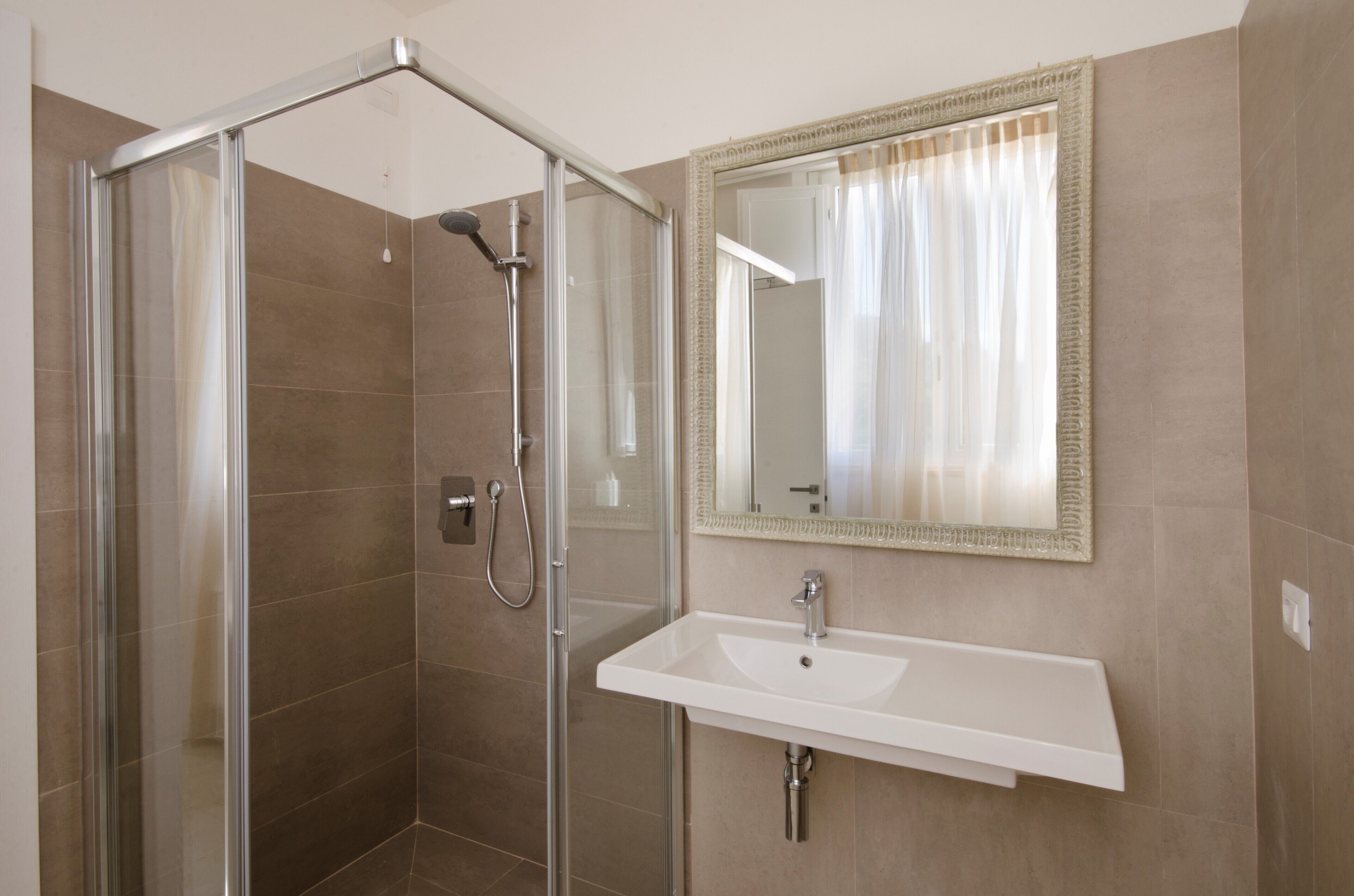 junior suite | bathroom | shower, eco-friendly toiletries, hair dryer, bathrobes