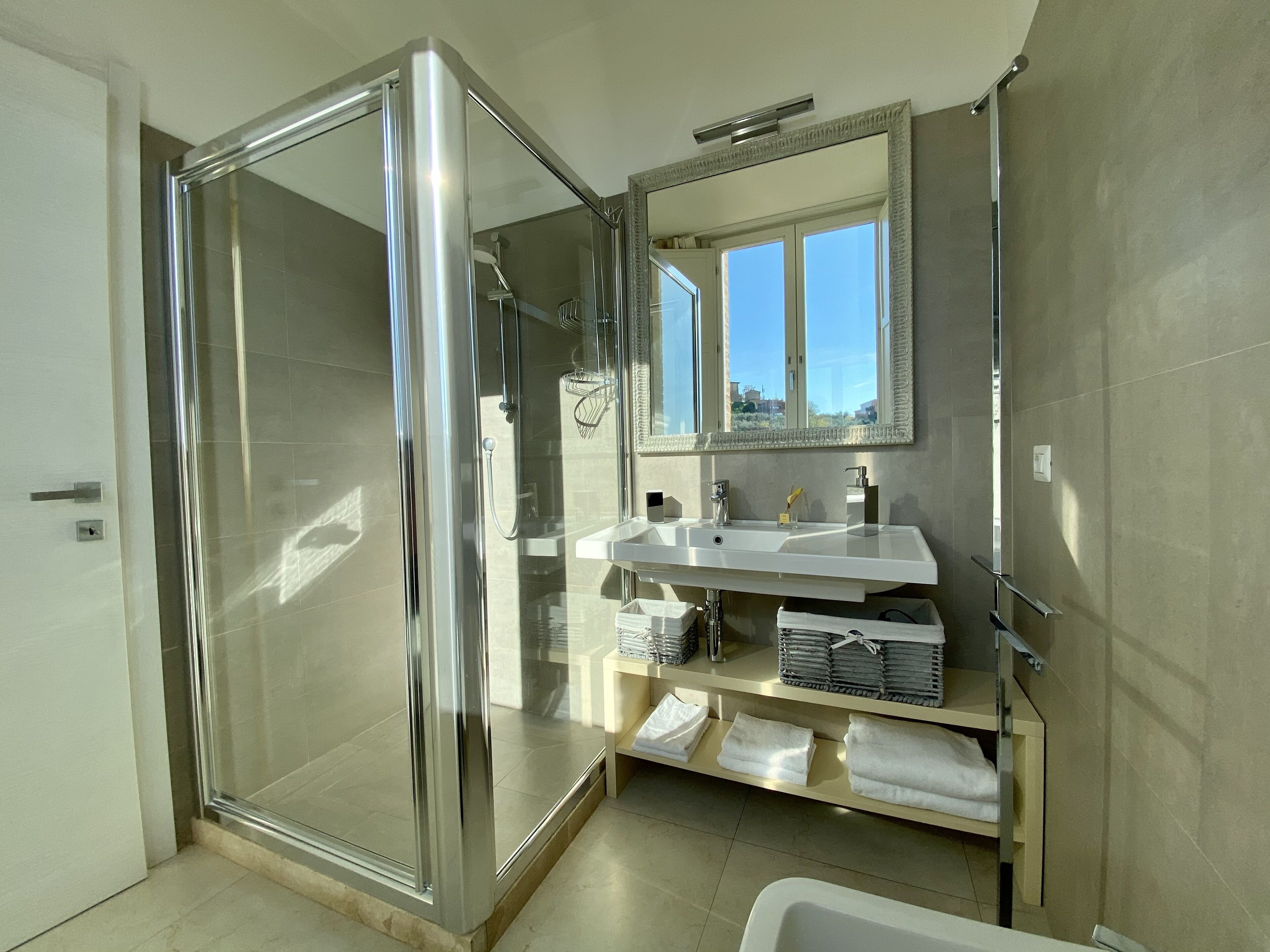 junior suite, city view | bathroom | shower, eco-friendly toiletries, hair dryer, bathrobes