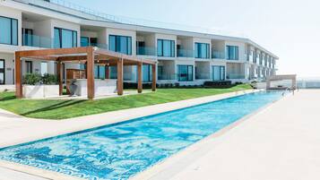 Indoor pool, outdoor pool, open 9:00 AM to 2:00 PM, pool umbrellas