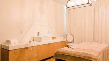 Enjoy a serene bathroom retreat with a sink, mirror, and ample natural light.