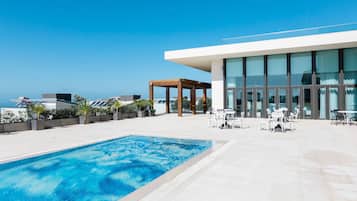 Indoor pool, outdoor pool, open 9:00 AM to 2:00 PM, pool umbrellas