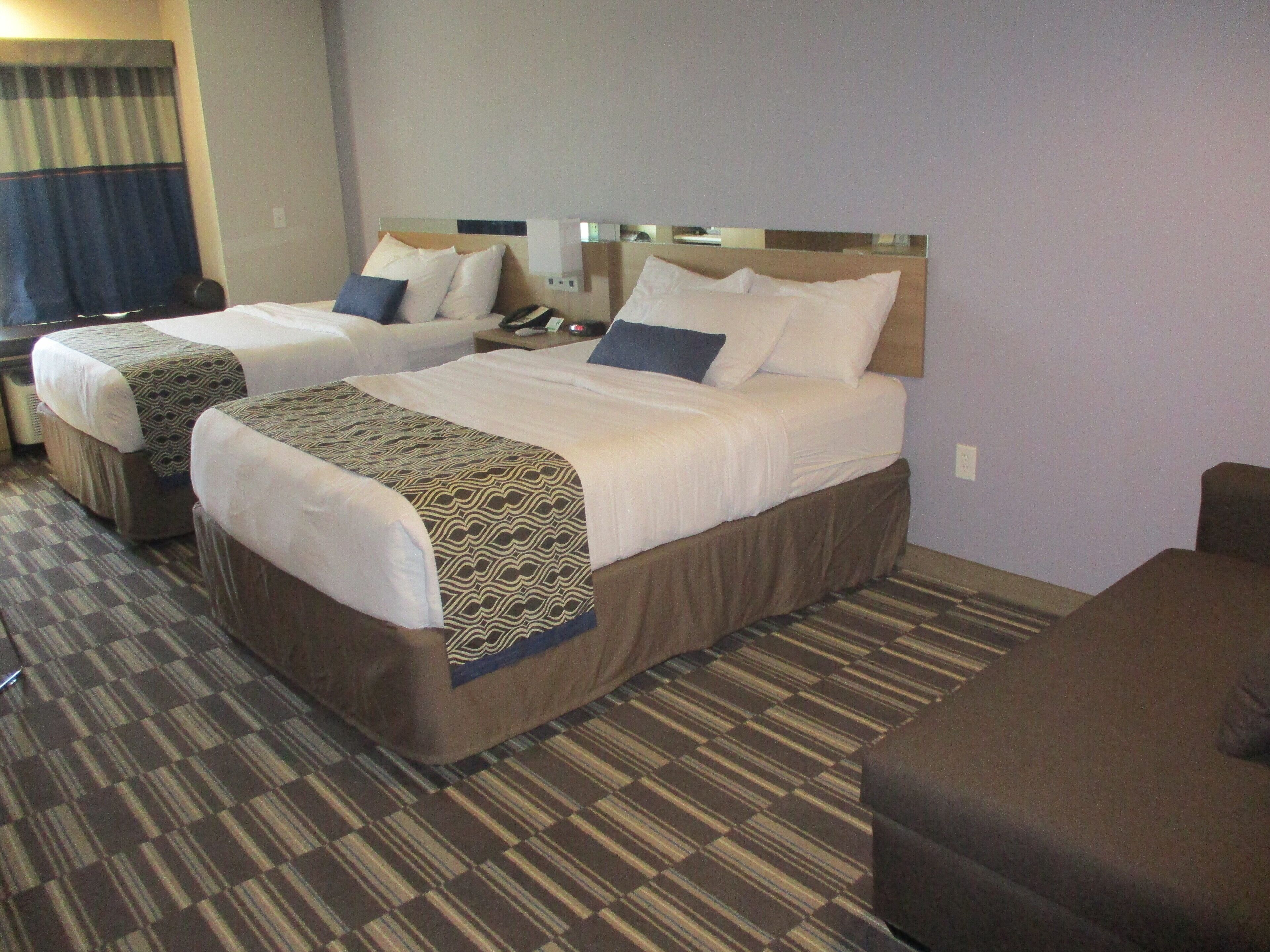 deluxe room, 2 queen beds, non smoking | bathroom | combined shower/bathtub, free toiletries, hair dryer, towels