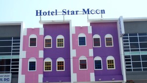 A multi-story hotel building with a prominent sign reading "Hotel Star Moon". - Hotel Star Moon (Malacca City)