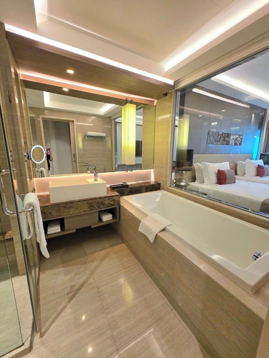deluxe twin room | bathroom | separate bathtub and shower, deep-soaking bathtub, rainfall showerhead