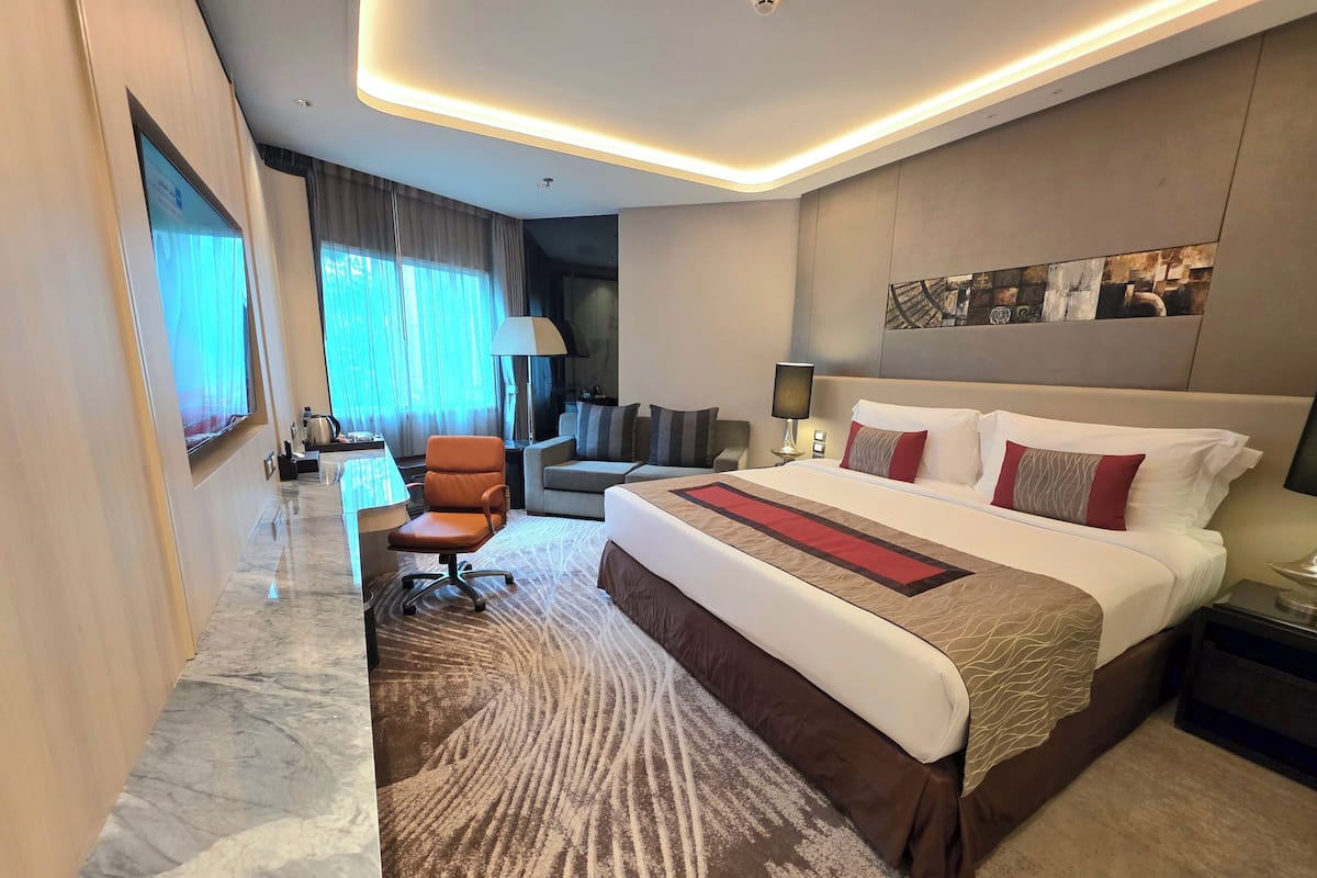 Deluxe King Room | Literie de qualité supérieure, minibar, coffres-forts dans les chambres