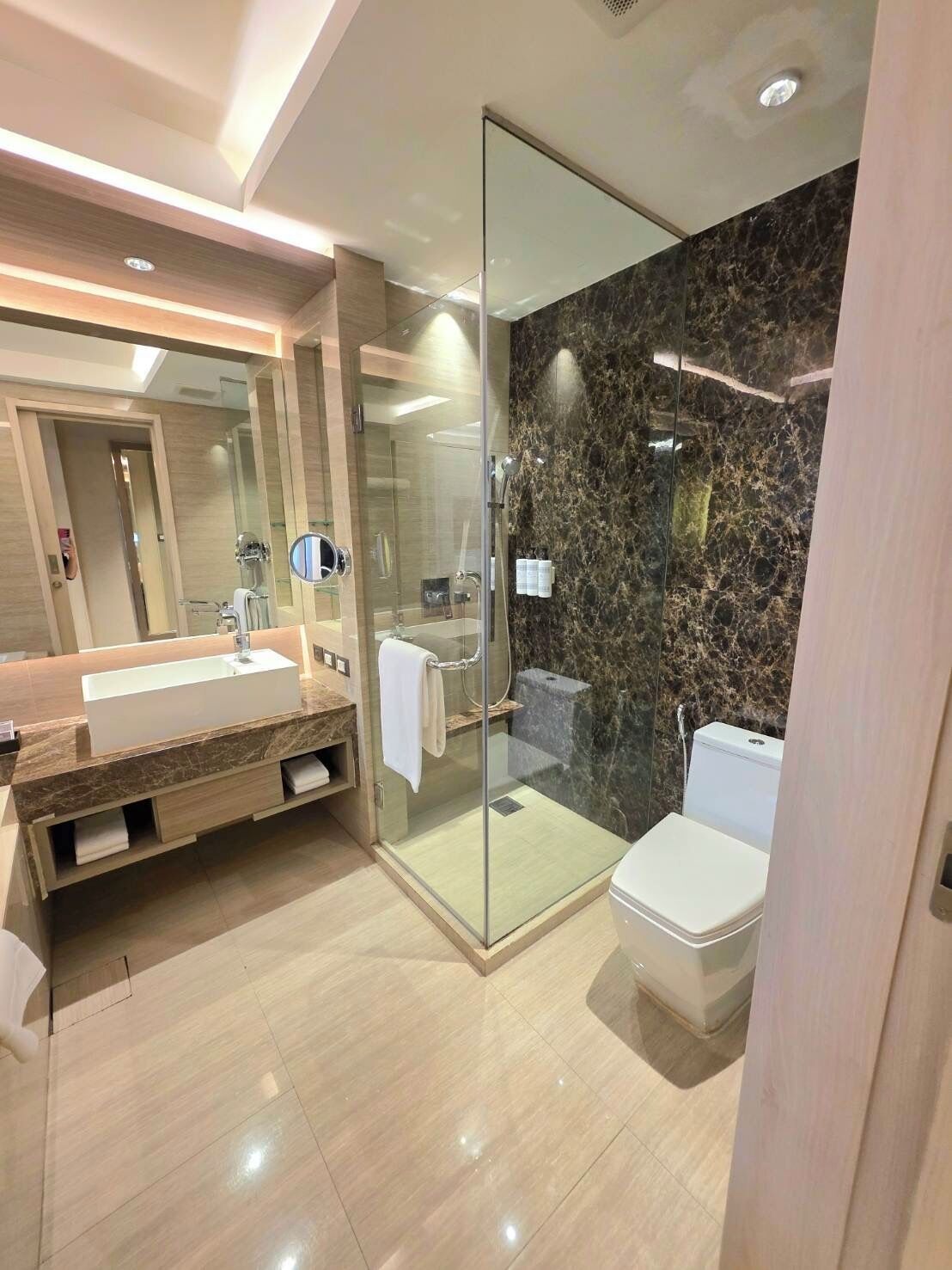 deluxe king room | bathroom | separate bathtub and shower, deep-soaking bathtub, rainfall showerhead