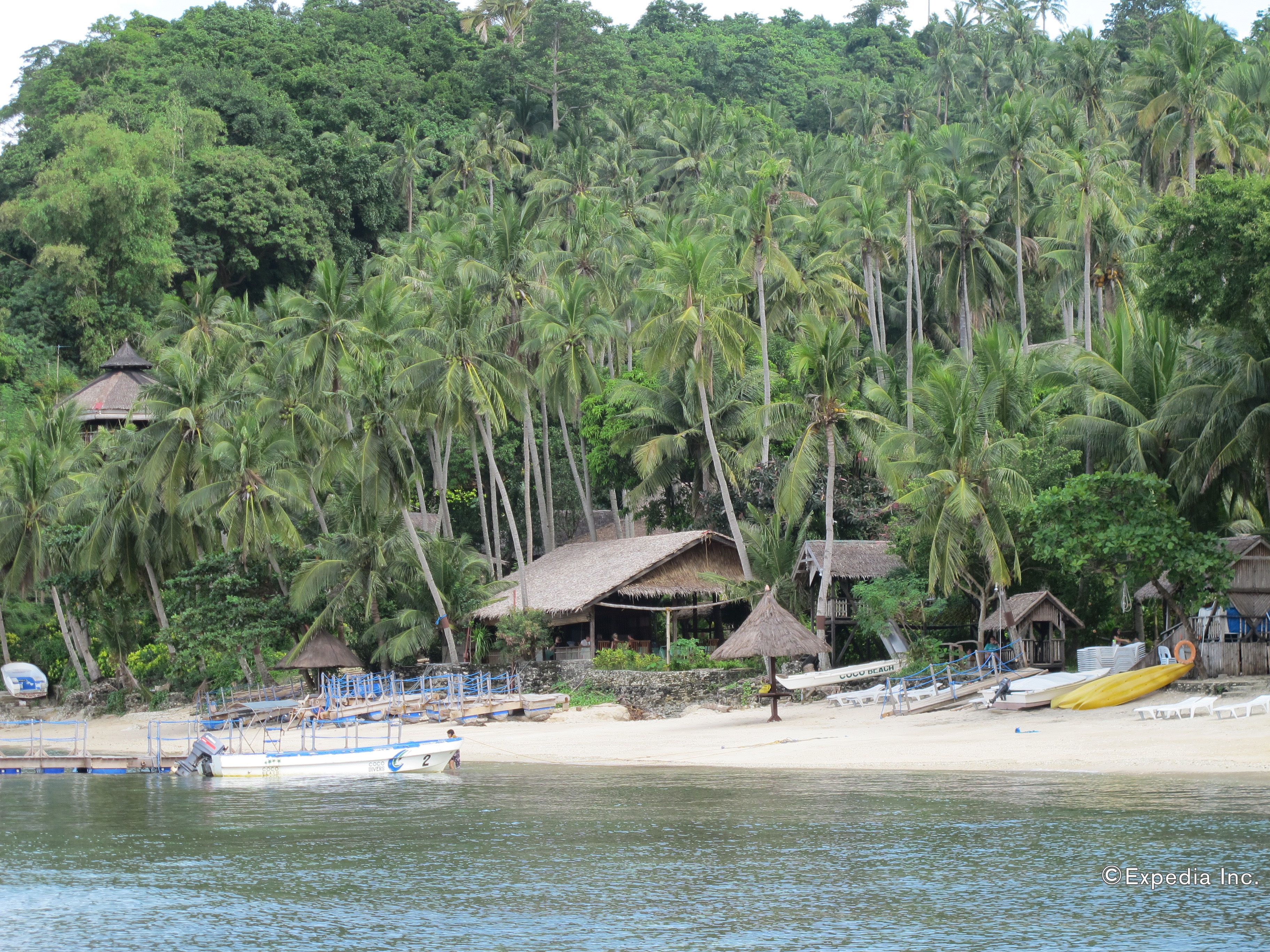 Private beach, white sand, beach umbrellas, scuba diving