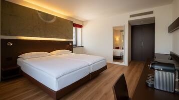 Hypo-allergenic bedding, down comforters, minibar, in-room safe