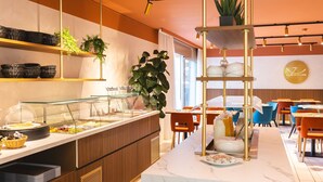 A buffet area with a marble counter, wicker baskets, and a variety of food items.