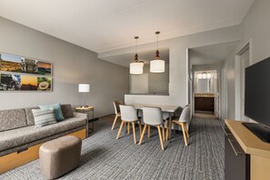 Suite, 2 Bedrooms | Living room | 32-inch flat-screen TV with cable channels, TV