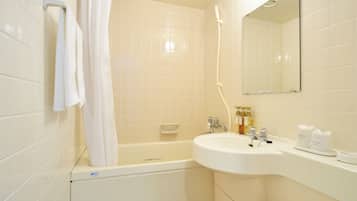 Combined shower/tub, free toiletries, hair dryer, slippers