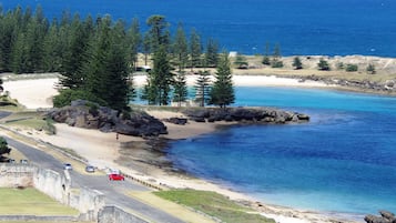 Beach nearby, white sand, beach towels