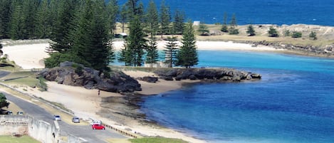 Beach nearby, white sand, beach towels
