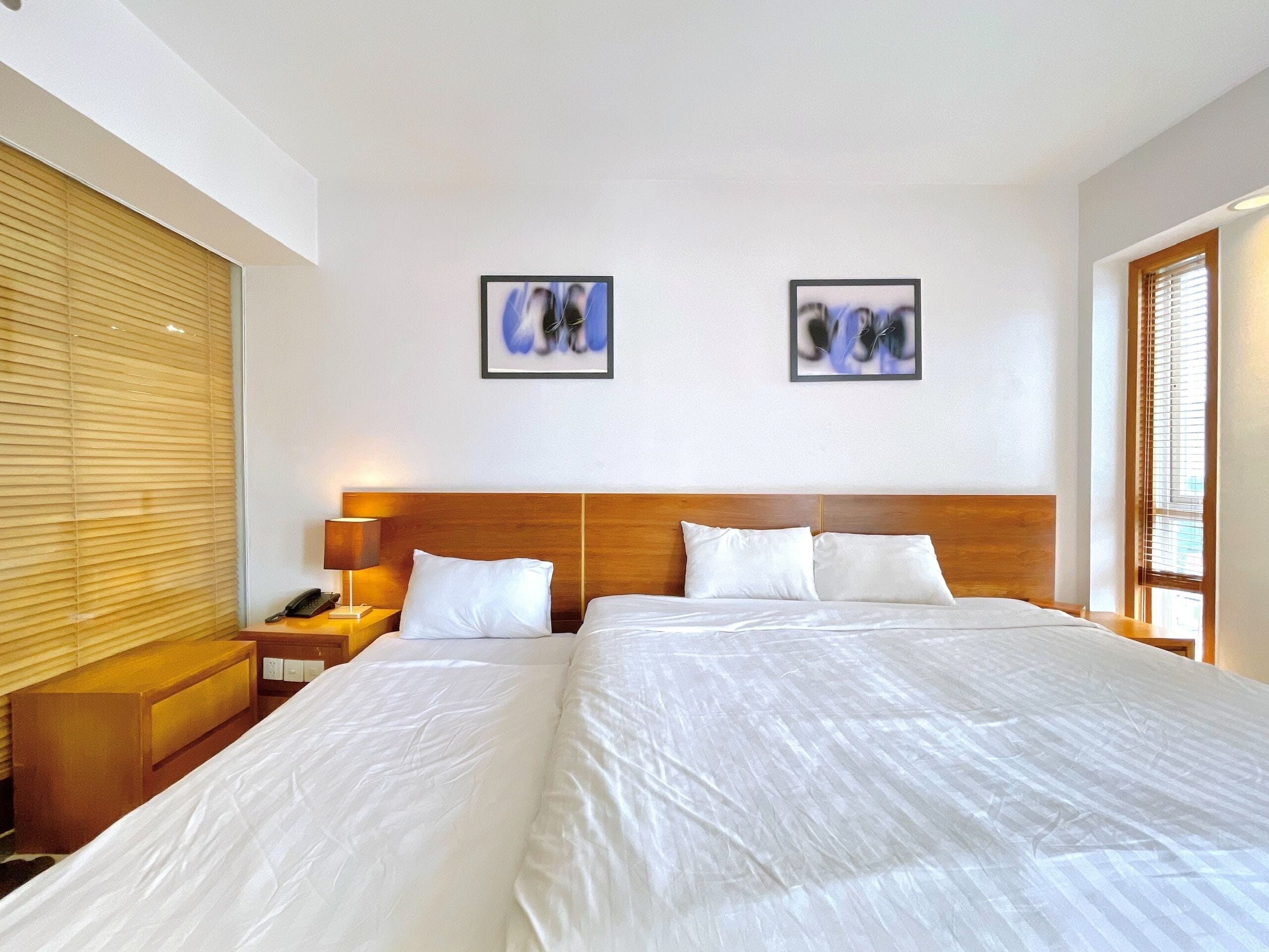 Deluxe Triple Room, Multiple Beds, City View | Free minibar items, in-room safe, desk, blackout drapes