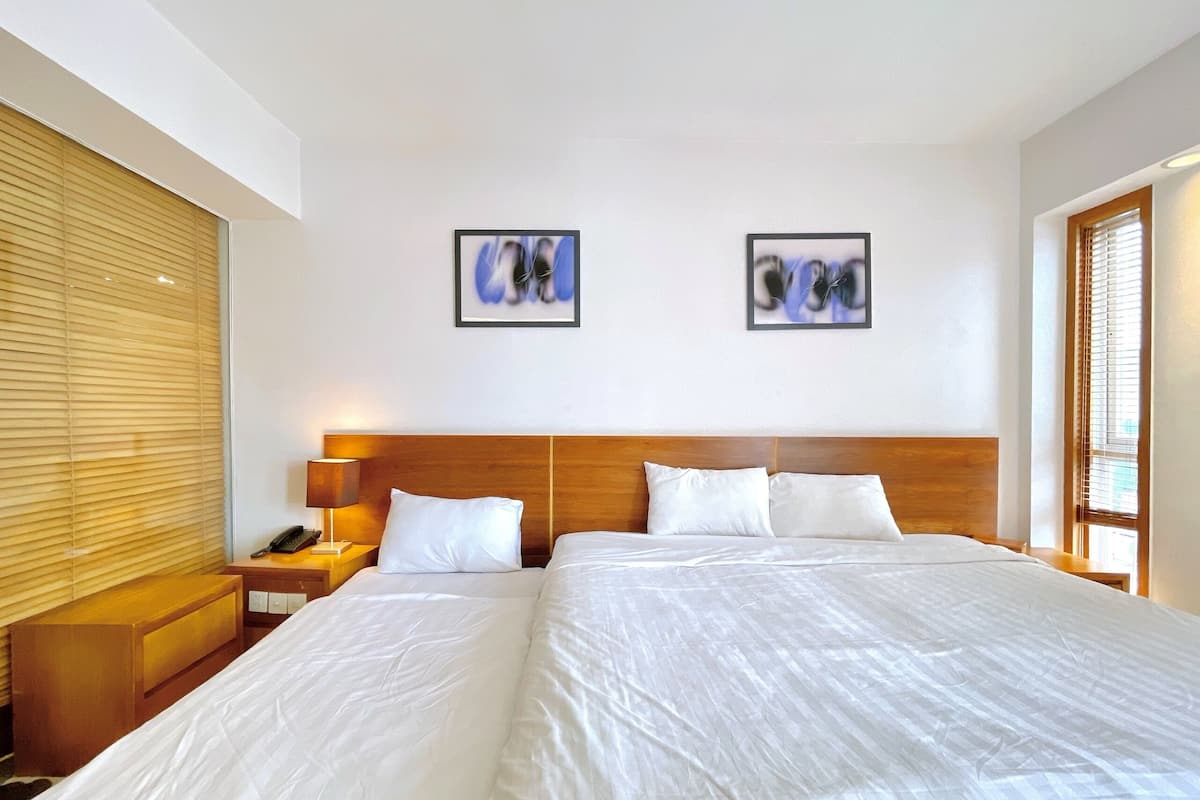 Deluxe Triple Room, Multiple Beds, City View | Free minibar items, in-room safe, desk, blackout drapes