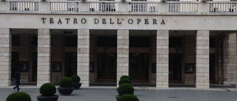 A building with the sign "TEATRO DELL'OPERA" indicating a theater.