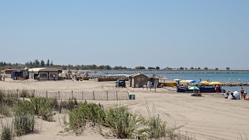 On the beach, white sand, 2 beach bars