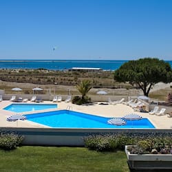 Seasonal outdoor pool, pool umbrellas, pool loungers