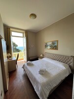 Double or Twin Room, Sea View | In-room safe, desk, cribs/infant beds, free WiFi