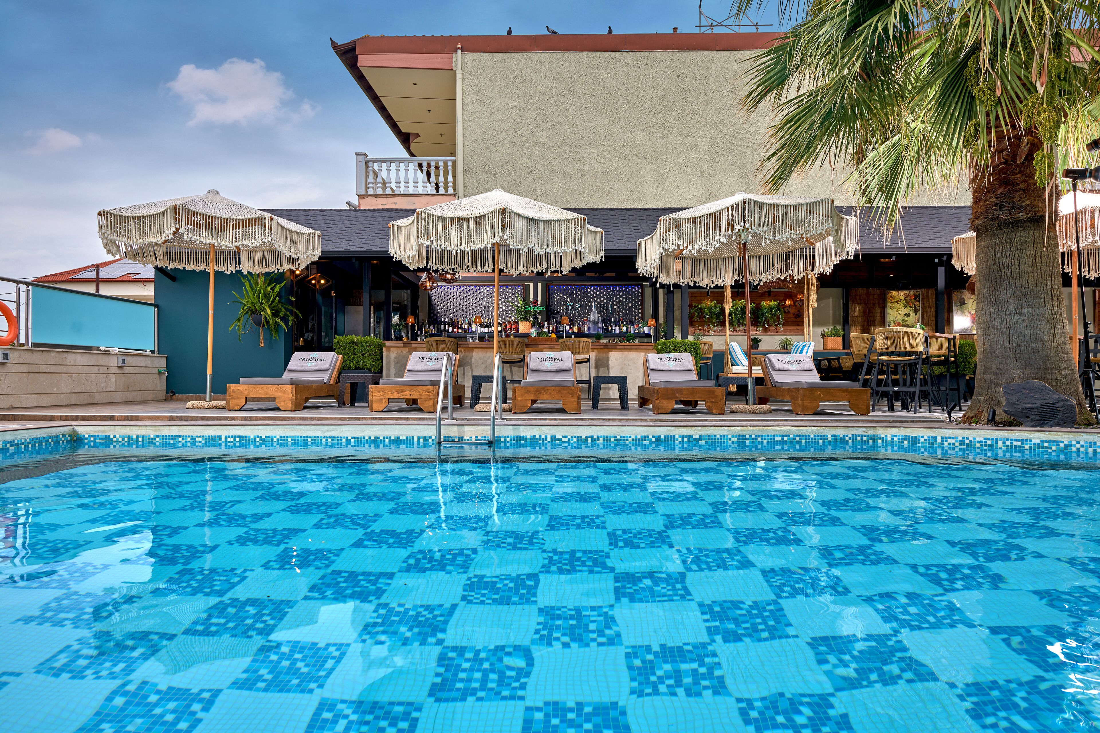 outdoor pool, open 9:00 am to 8:30 pm, pool umbrellas, pool loungers