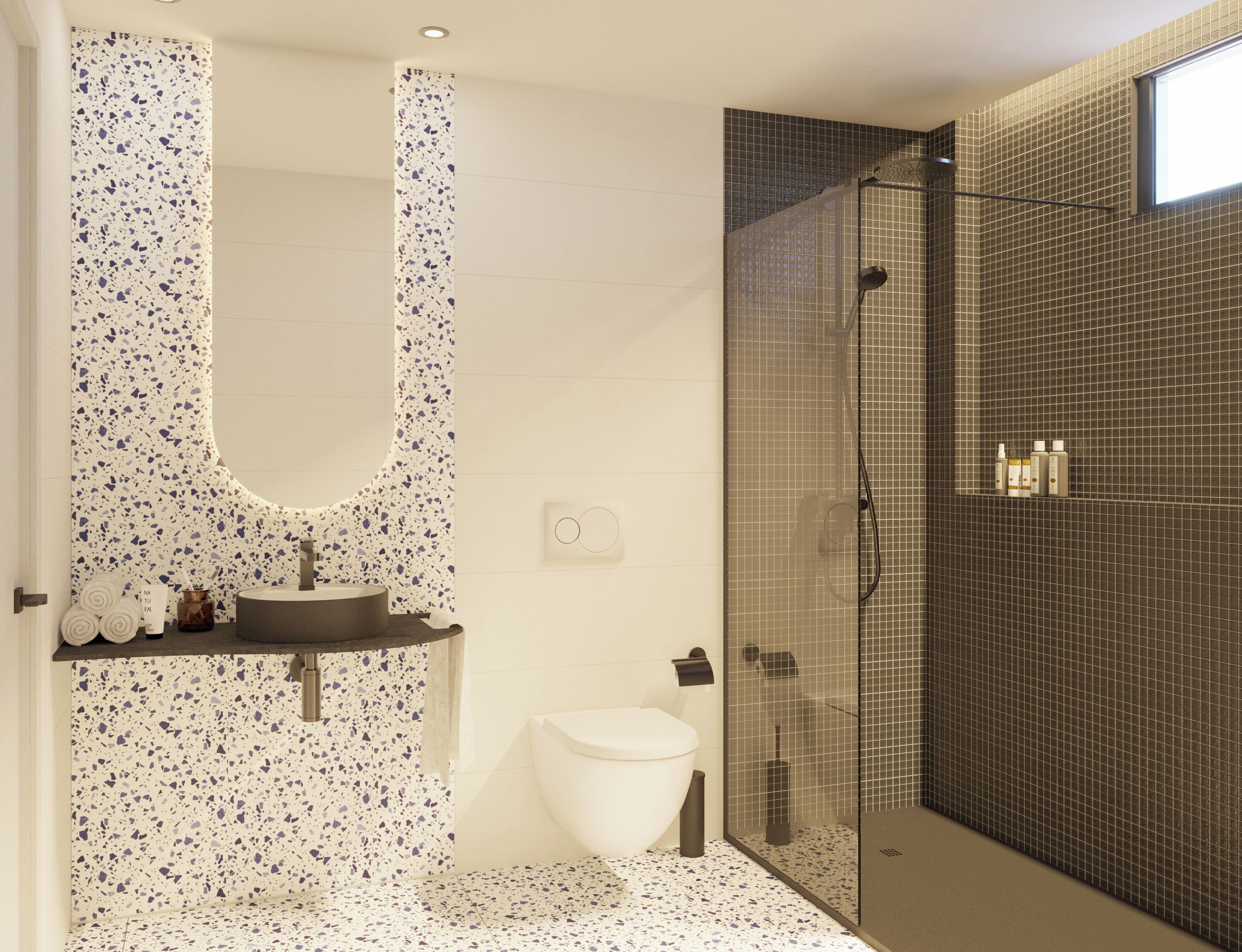 A modern bathroom with a freestanding sink, a toilet, and a glass-enclosed shower area.